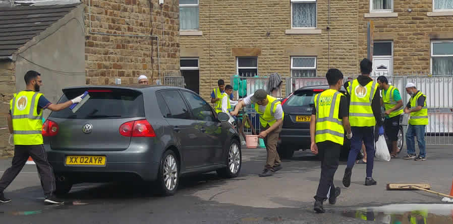 Raising Money for cancer research UK with community car wash